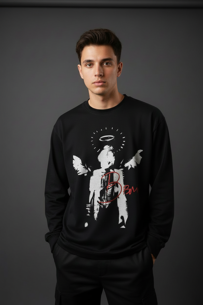 Person wearing a black sweatshirt with graphic design on a gray background